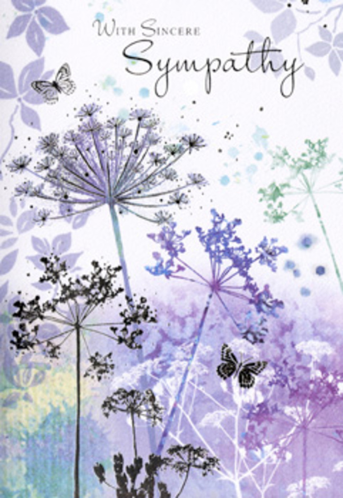 The design of this sympathy card feels like a quiet moment spent overlooking the trees and open skies near Highams Park, where nature has a way of softening sorrow. Across the front, tall wildflowers with filigree, umbelliferous heads sway gently on fine, arching stems. They are painted in layered tones of violet, lavender, powder blue, and silvery green, so delicately shaded that each bloom appears almost etched by hand. The petals and seed heads are light and airy, with tiny gaps of untouched paper shining through, giving the sense of dappled light filtering between tiny blossoms. Behind the flowers, a softly blurred background stretches out in cool washes of purple and blue-grey, reminiscent of a dewy morning meadow or the distant tree line beyond the local playing fields. The colours fade seamlessly into one another, creating a soothing, meditative backdrop. Two butterflies, softly outlined and semi-transparent, hover above the wispy petals, suggesting continuity and hope, like small, reassuring signs noticed on a reflective walk after a funeral service. The entire image is suffused with a gentle luminosity, with no harsh shadows, only a tender glow that invites quiet contemplation. The composition is balanced and uncluttered, leaving space for the emotions it is meant to accompany. It feels like something chosen by a caring Highams Park florist to travel alongside a condolence bouquet: a visual whisper of support, acknowledging loss while offering a momentary sanctuary of calm through nature's quiet beauty.