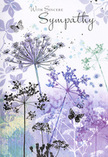 This sympathy card reads like a soft-spoken poem in watercolour, echoing the stillness you might feel walking through the green corners of Highams Park at dusk. Airy silhouettes of wildflowers rise in slender clusters from the base of the card, their umbelliferous heads finely detailed yet feather-light. Shades of lavender, indigo, and cool blue mingle with touches of silvery green, creating an elegant palette that calms rather than overwhelms. Each stem seems to reach upward as if seeking light, the tips fading delicately into the surrounding haze. Behind them, faint impressions of additional foliage and seed heads drift across a background washed with muted purples and soft blue-grey, lending a dreamy, almost meditative atmosphere. The colours blend like distant clouds reflected in still water, with no sharp edges, only gentle transitions. Scattered among the blossoms, a few butterflies hover in quiet suspension, their pale, almost transparent wings hinting at transformation, remembrance, and the way love lingers beyond parting. The mood is tender and contemplative, like a private moment of reflection after leaving flowers at a memorial. The overall effect is one of respectful solace: a design that wraps the viewer in a sense of quiet understanding. It's the sort of card a local florist near the Highams Park shops might carefully select to accompany a simple, graceful tribute, allowing the image and message to speak softly to someone navigating the weight of grief.